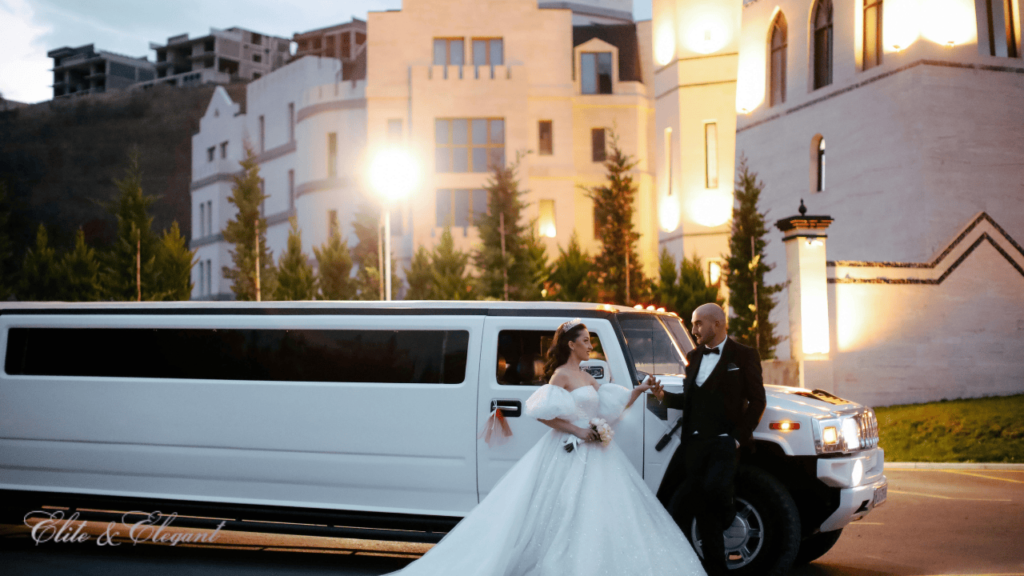 Wedding Couple with White Stretch Limousine in the Background