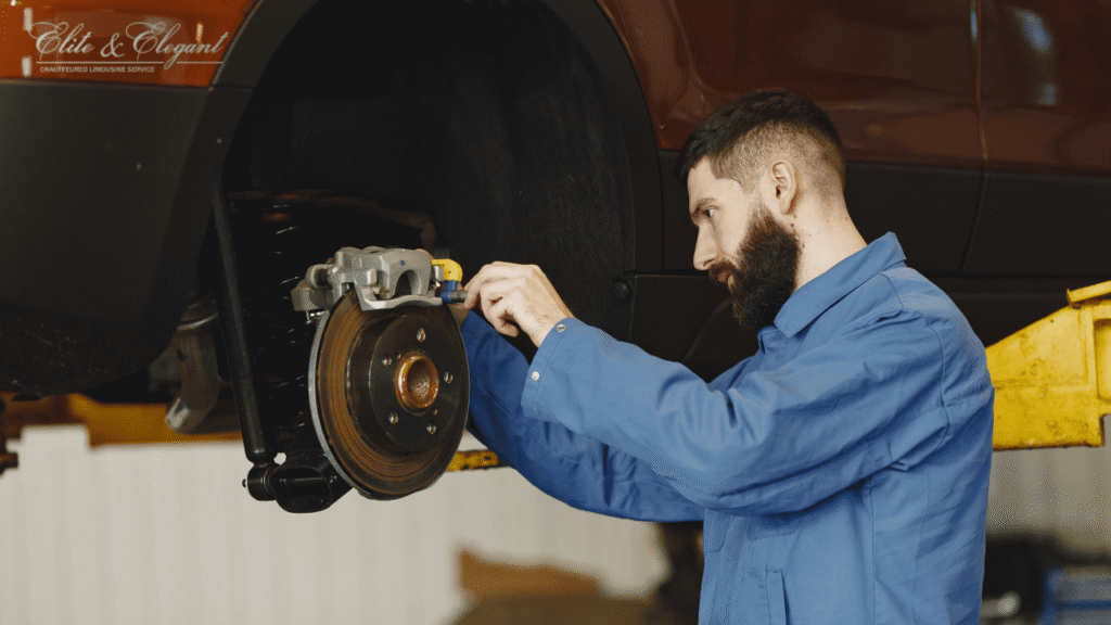 Car Technician Checking And Working On A Limo Car Break For Preventive Maintenance